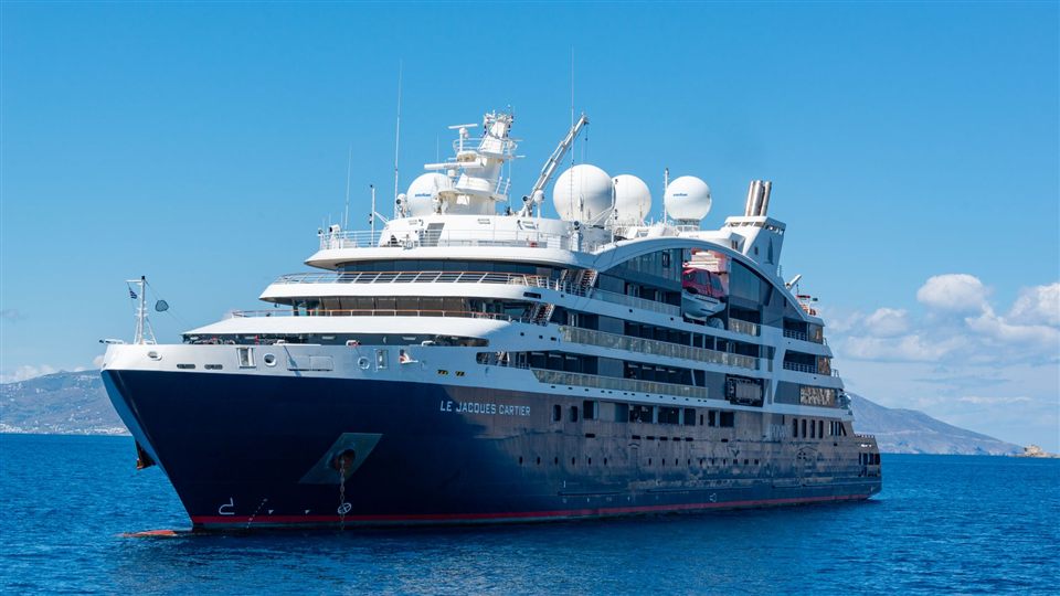 A small premium expedition cruise ship on open water